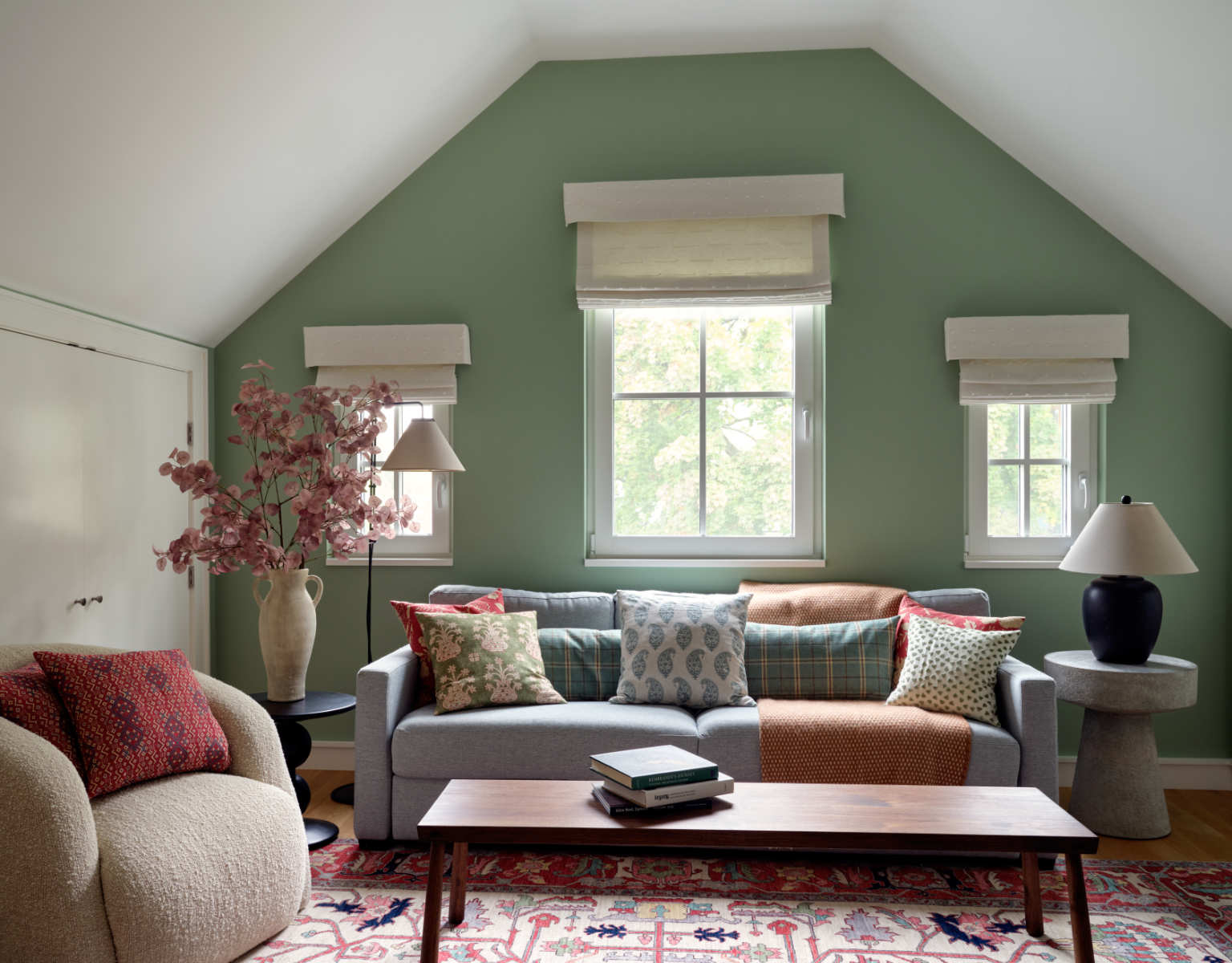 A living room filled with furniture and a window - Before Image