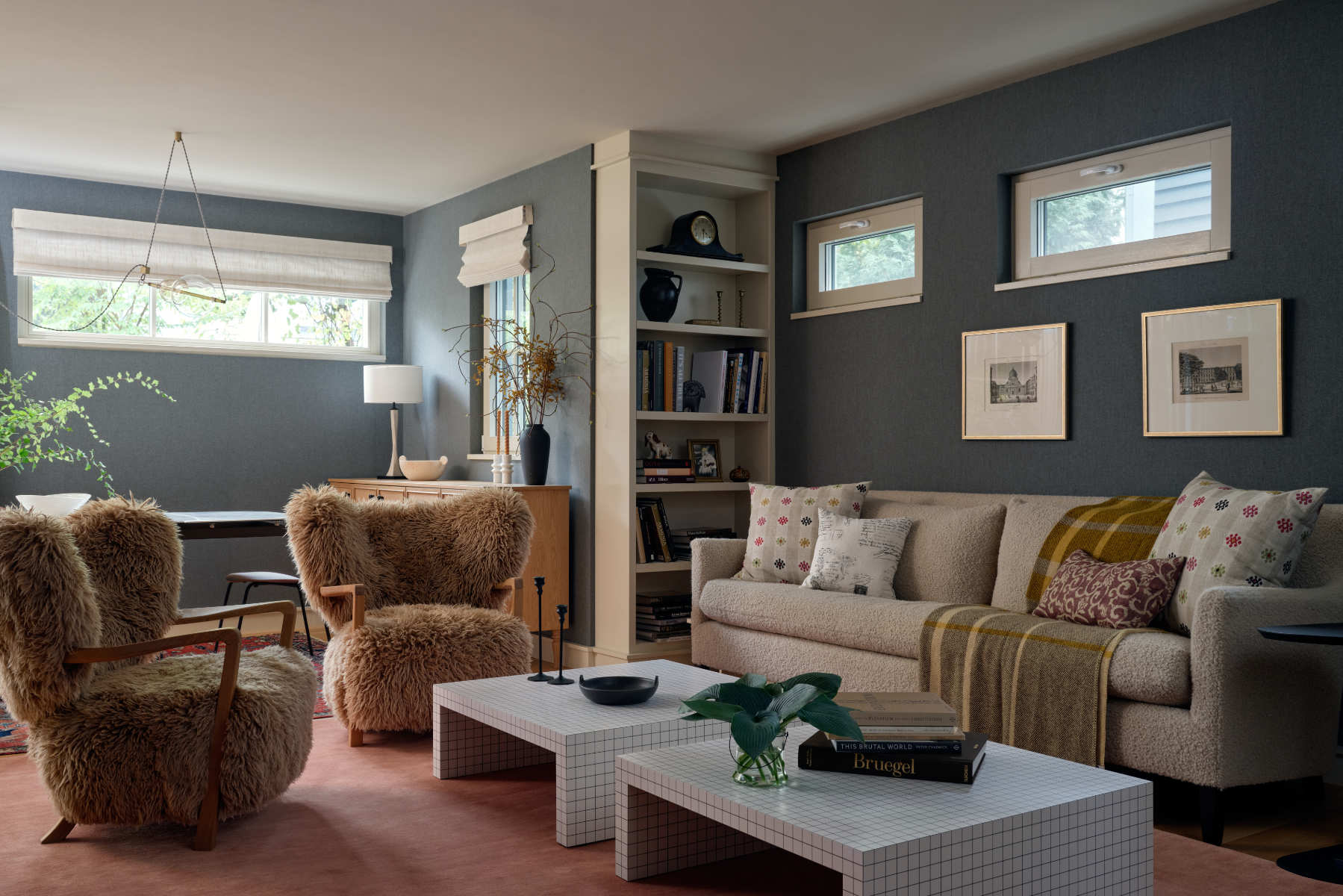 A living room filled with furniture and a window - Before Image