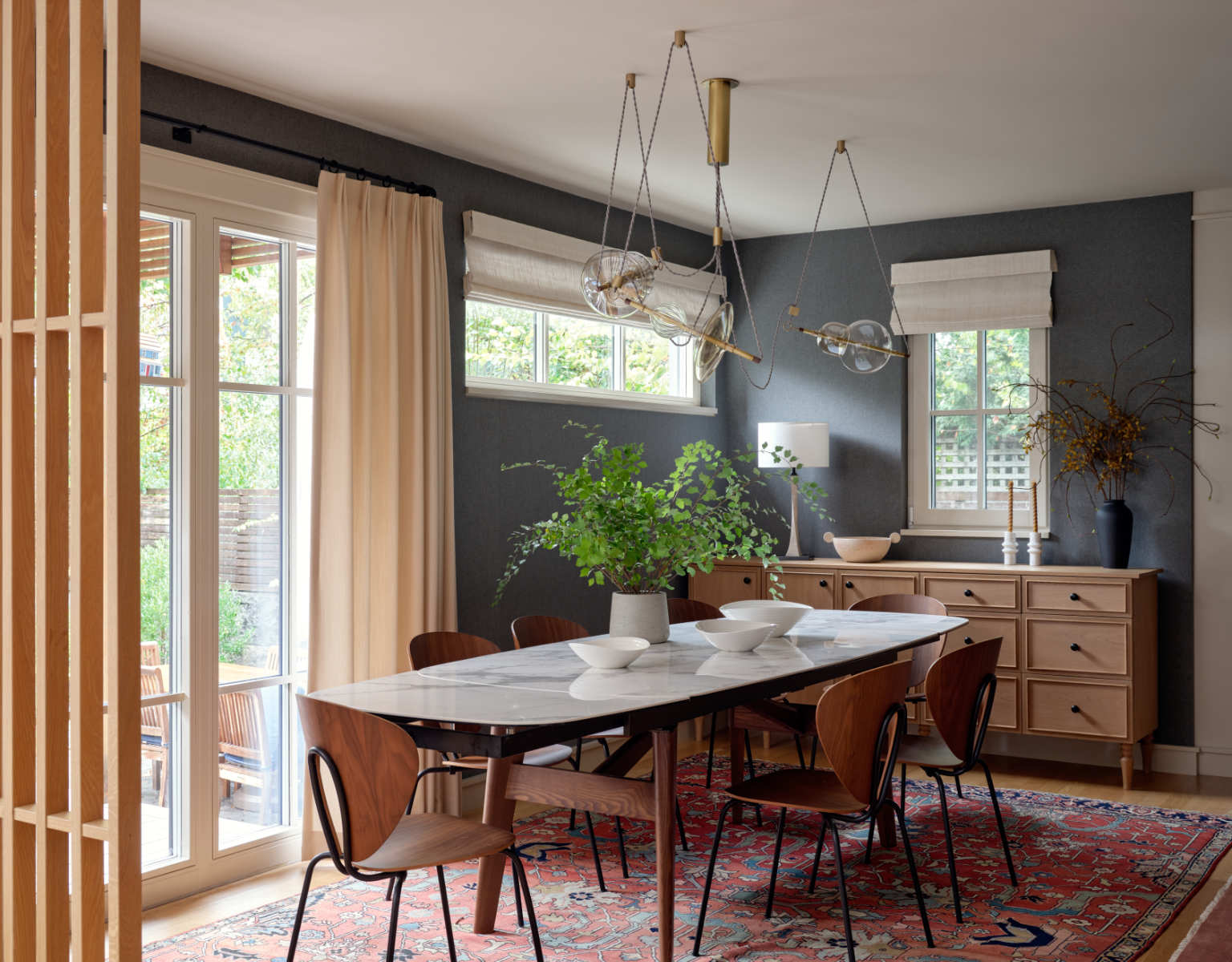 A dining room with a table and chairs - Before Image