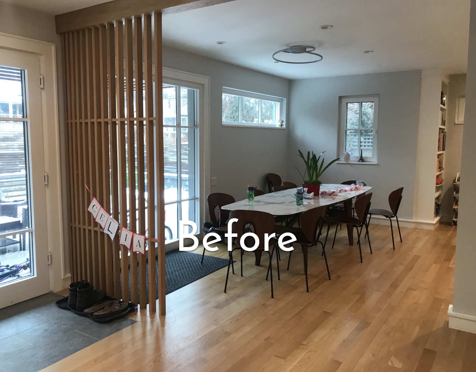 A dining room with a table and chairs